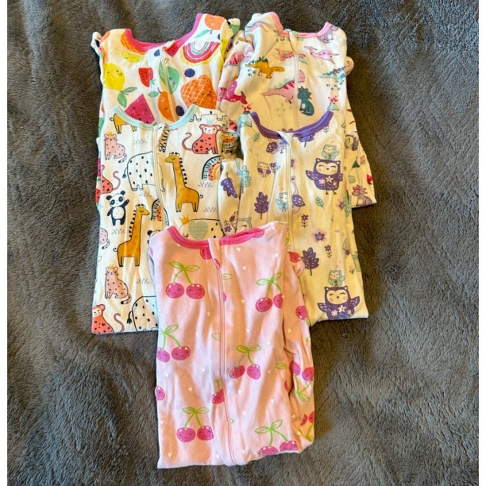 Bundle of baby girl sleepers.